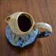 Blue flamed stoneware jug