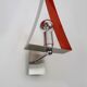 Pair of triangular wall sconces in chrome metal and orange. 1970s.