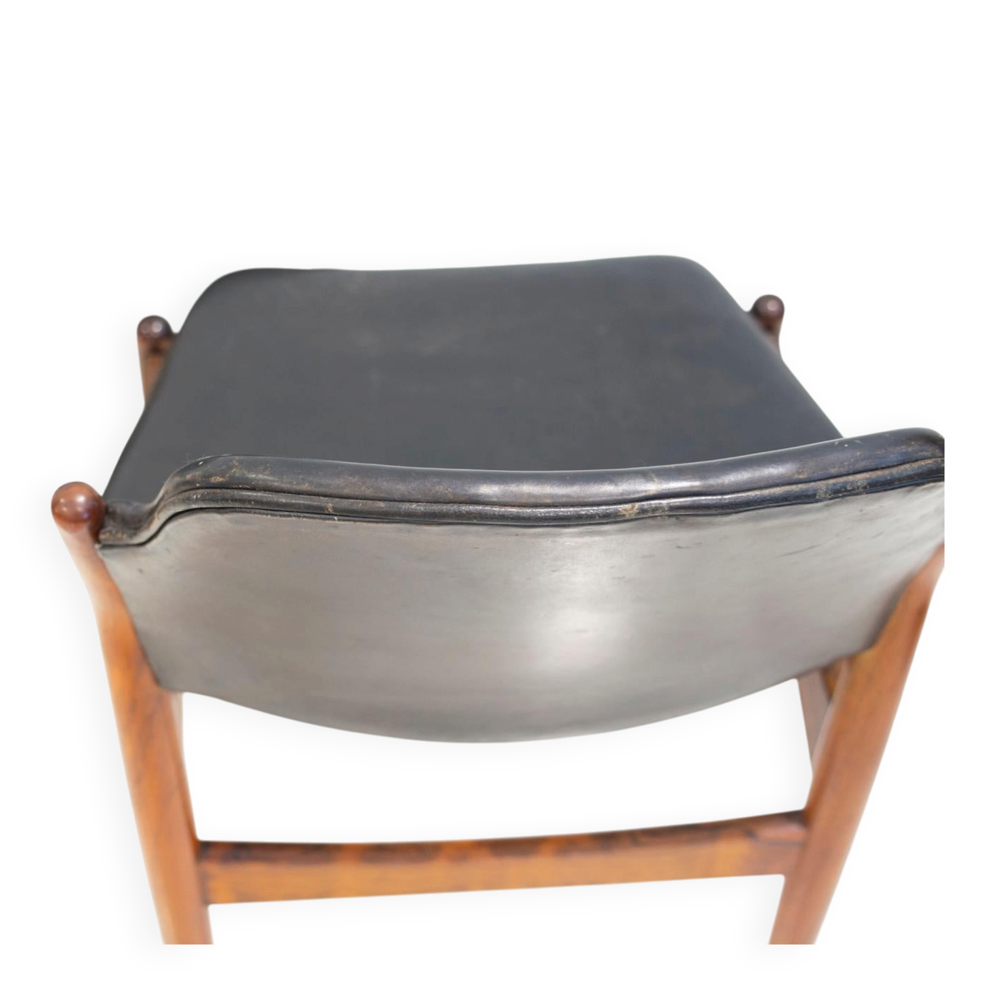 Set of four Arne Vodder chairs in hardwood and black leather.