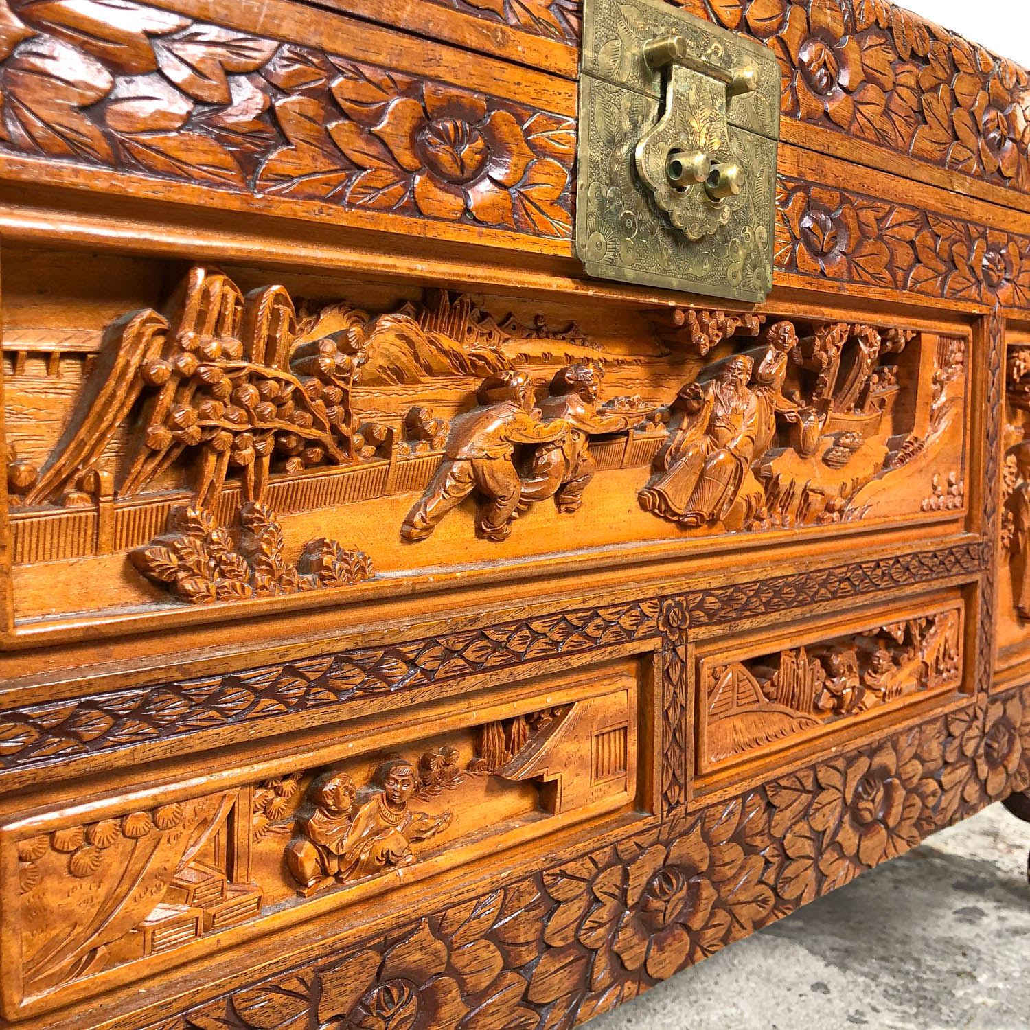 Vintage Chinese carved camphor wood chest on claw feet