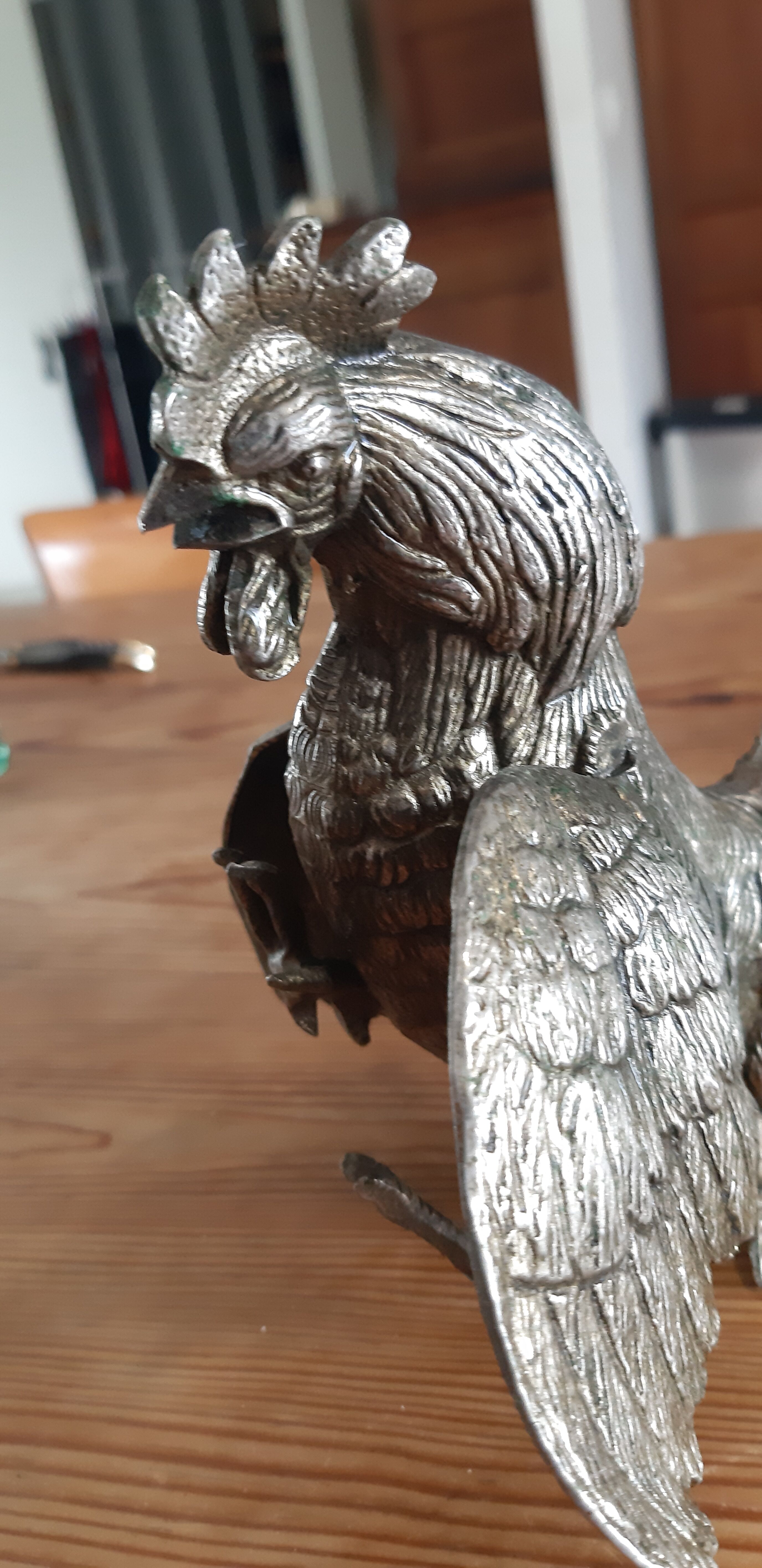 2 silver metal roosters