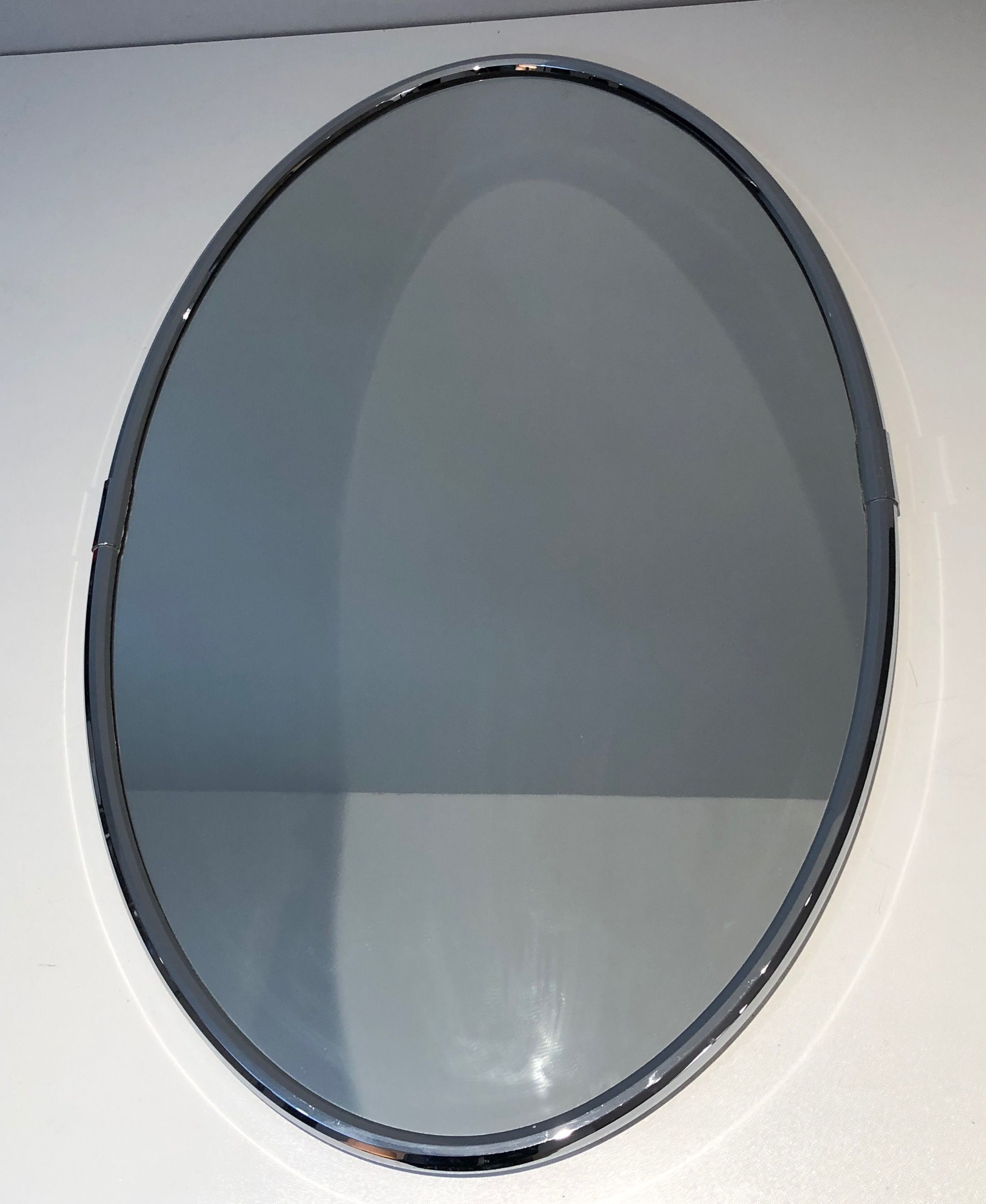 Oval chrome mirror in Art Deco style. Circa 1970.