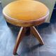 Adjustable vintage piano stool made of wood and velvet
