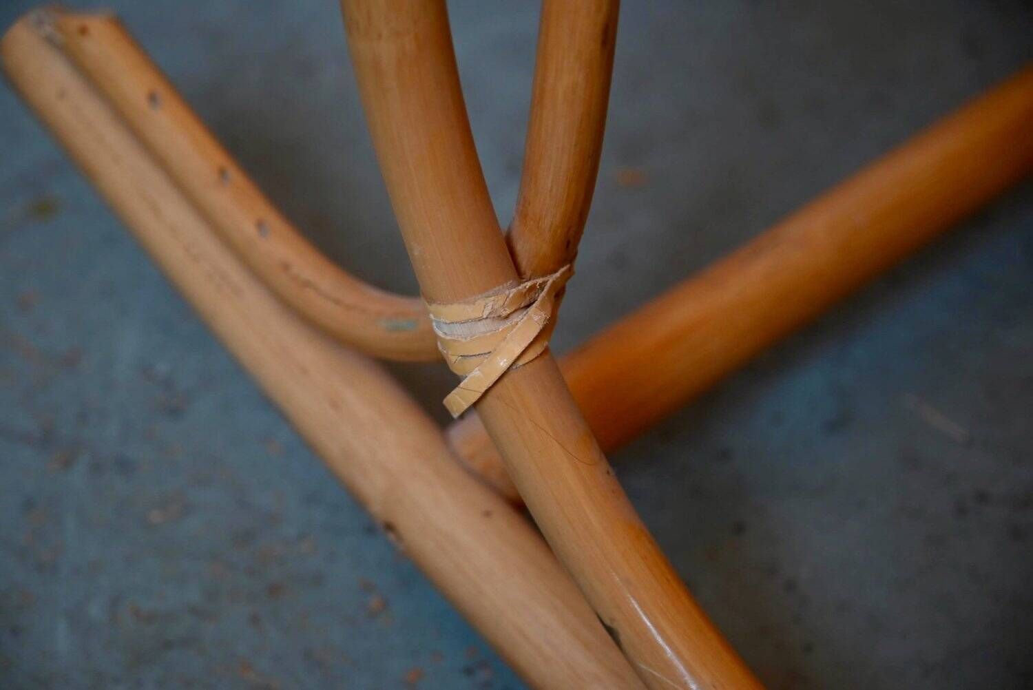 Vintage rocking chair in rattan from the 60s-70s, high openwork backrest.