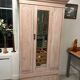 Antique English wardrobe in pale pink patina.