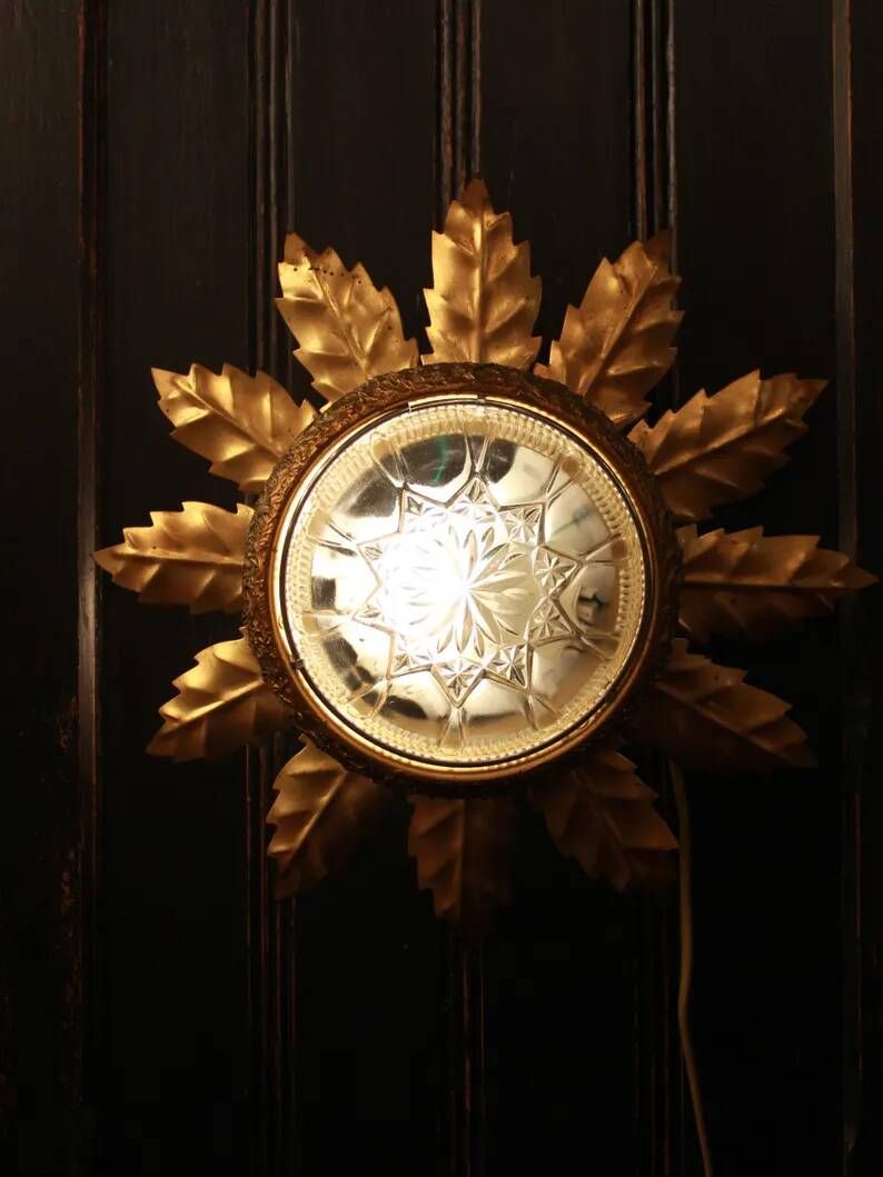 Gold metal wall sconce with cut glass in Hollywood Regency style from the 1960s.