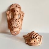 Pair of terracotta wall candle holders