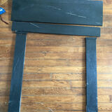 Black marble fireplace mantel