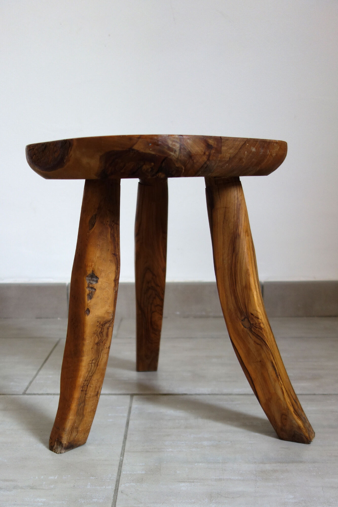 Brutalist stool made of olive wood