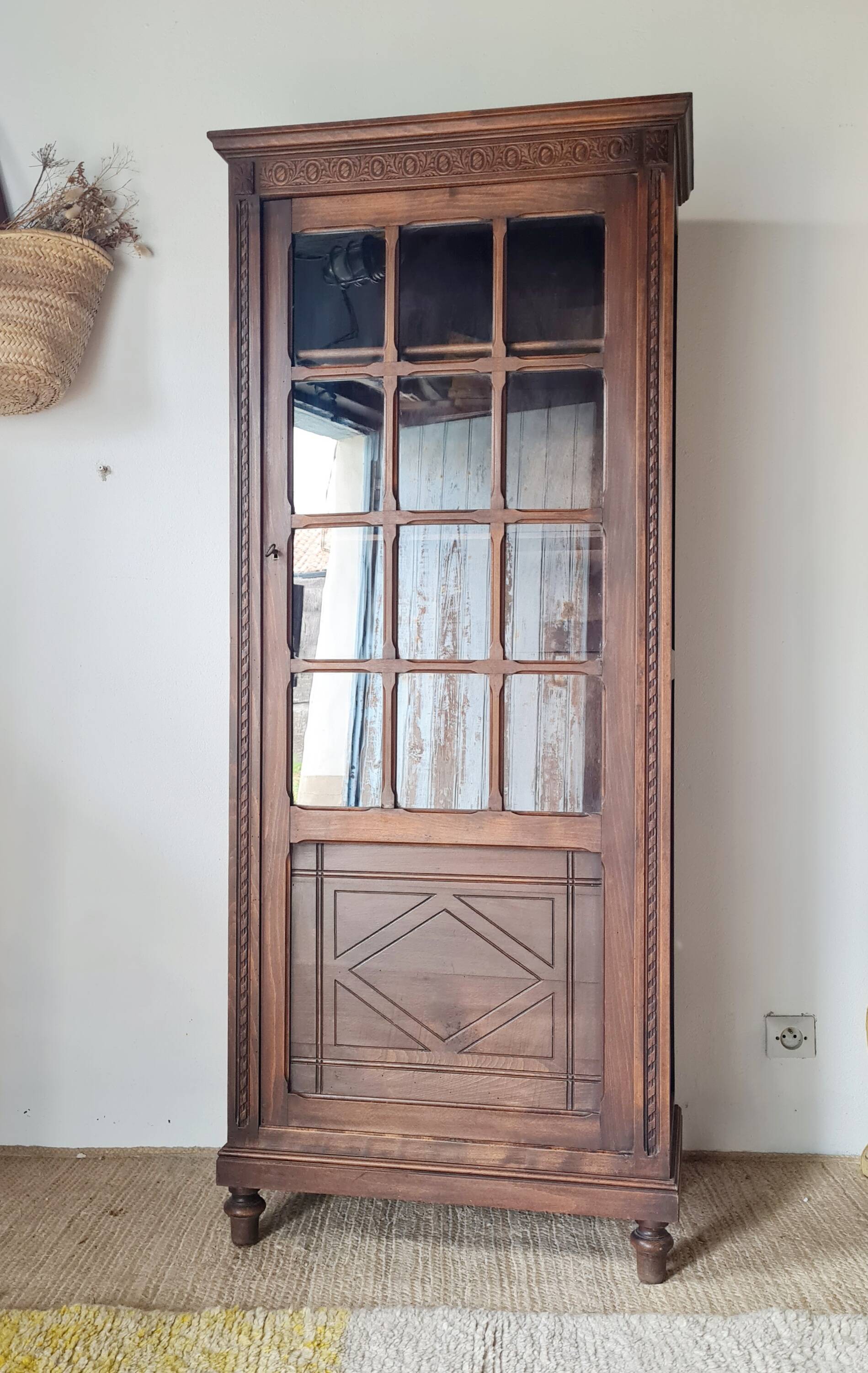 Old glass-fronted library in solid wood