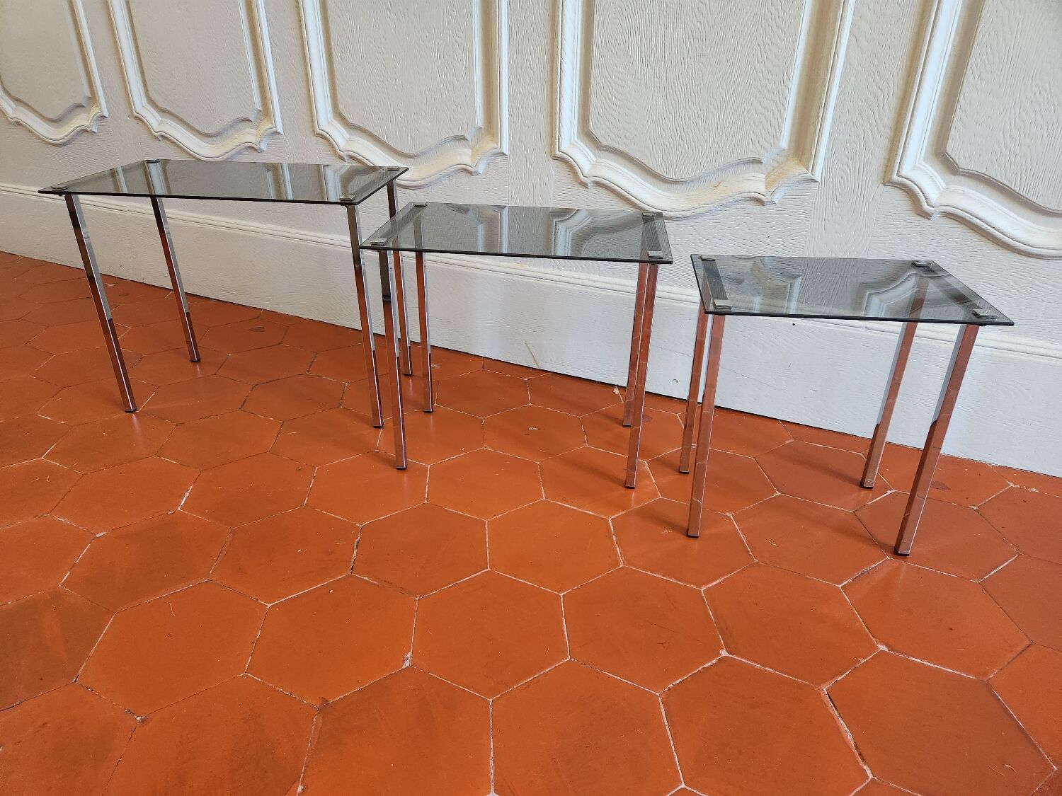 3 nesting tables from the 1970s in smoked glass.