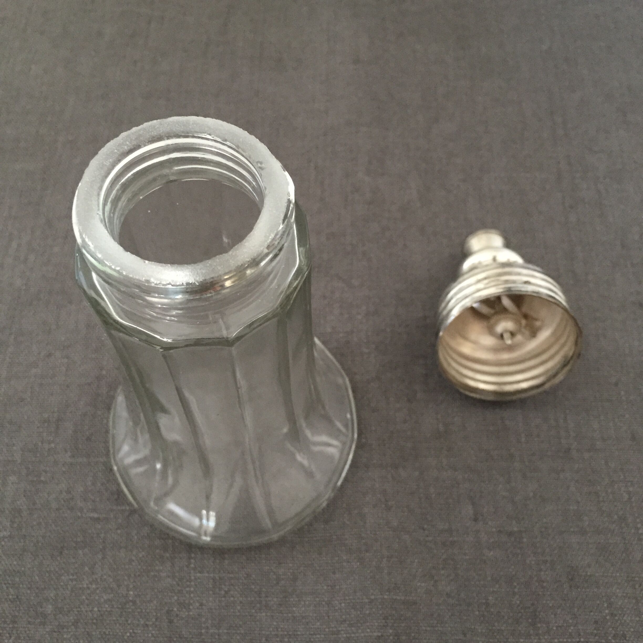 Glass sugar sprinkler and silver metal