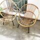 2 rattan shell armchairs, metal legs year 50