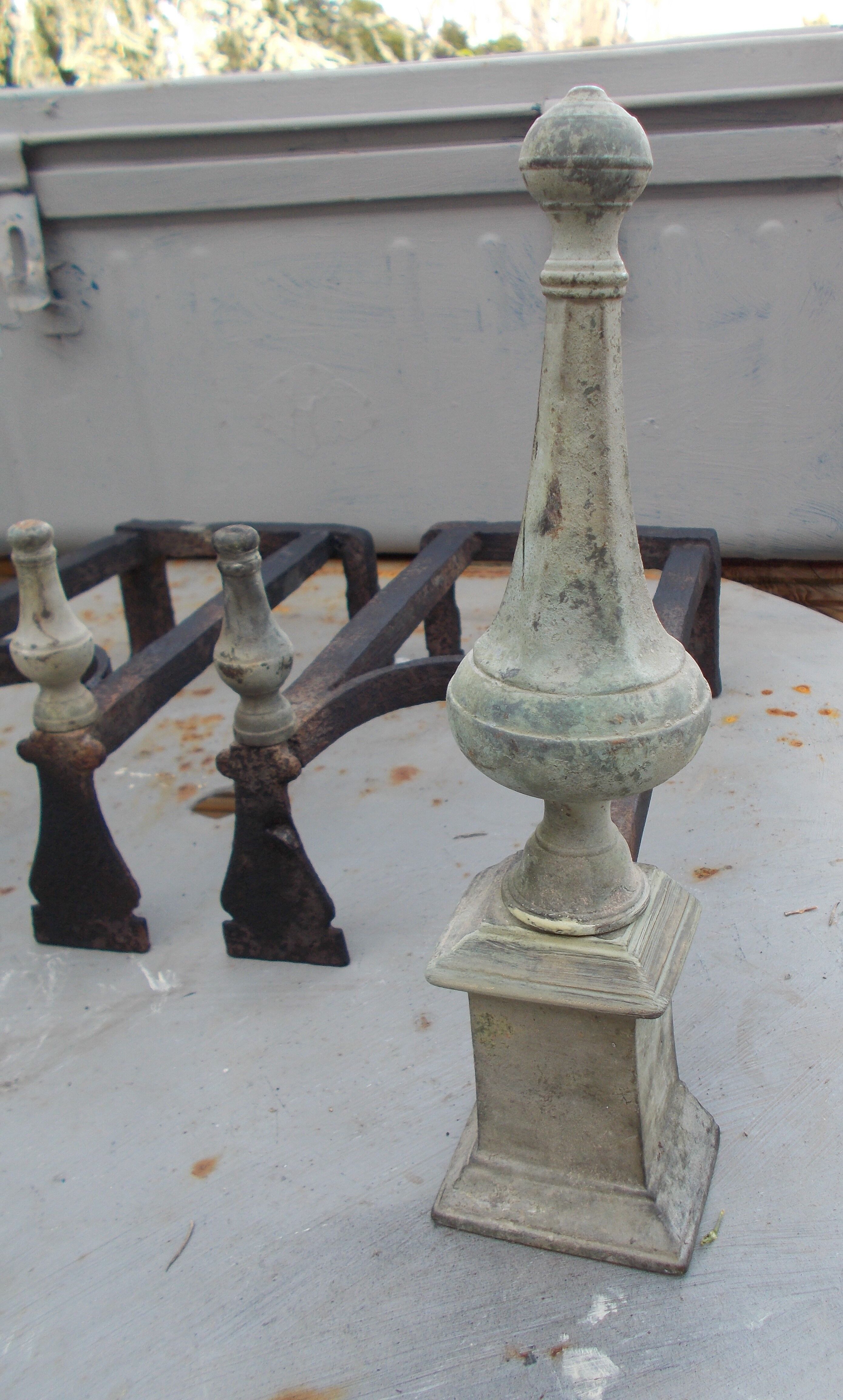 Old pair of wrought iron and bronze pegs