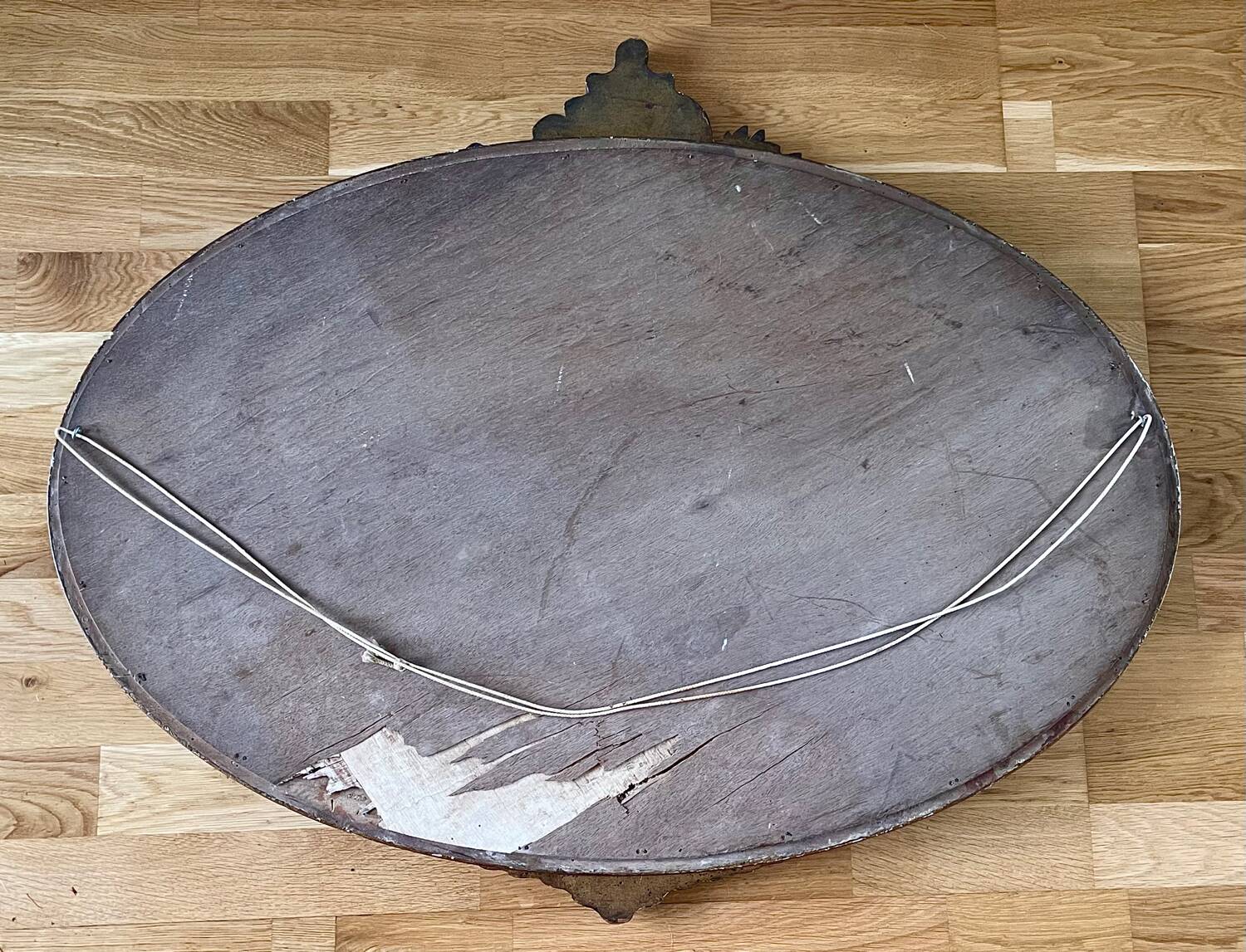 Antique oval gilt mirror.