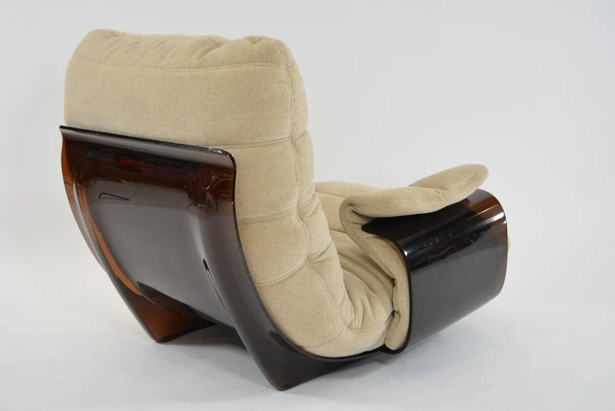 Marsala armchair and its light beige Ligne Roset footrest.