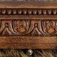 Antique musical trivet made of carved wood and Belle Époque earthenware.