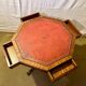 Vintage octagonal gueridon, 4 drawers, leather top, lion's paw feet.