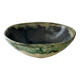 Green bowl signed with an eye
