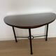 Half-moon console grange in solid cherry wood and wrought iron with a glass top.