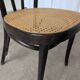 Chaise de salle à manger vintage style Thonet en bois noir et assise en cannage 1970