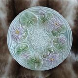 Antique cup and saucer in majolica.