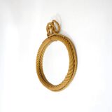Large oval mirror in rope with pediment, 64cm x 56.5cm.