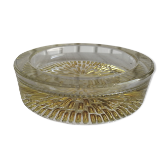 Empty round pockets of iridescent transparent glass of yellow sticks