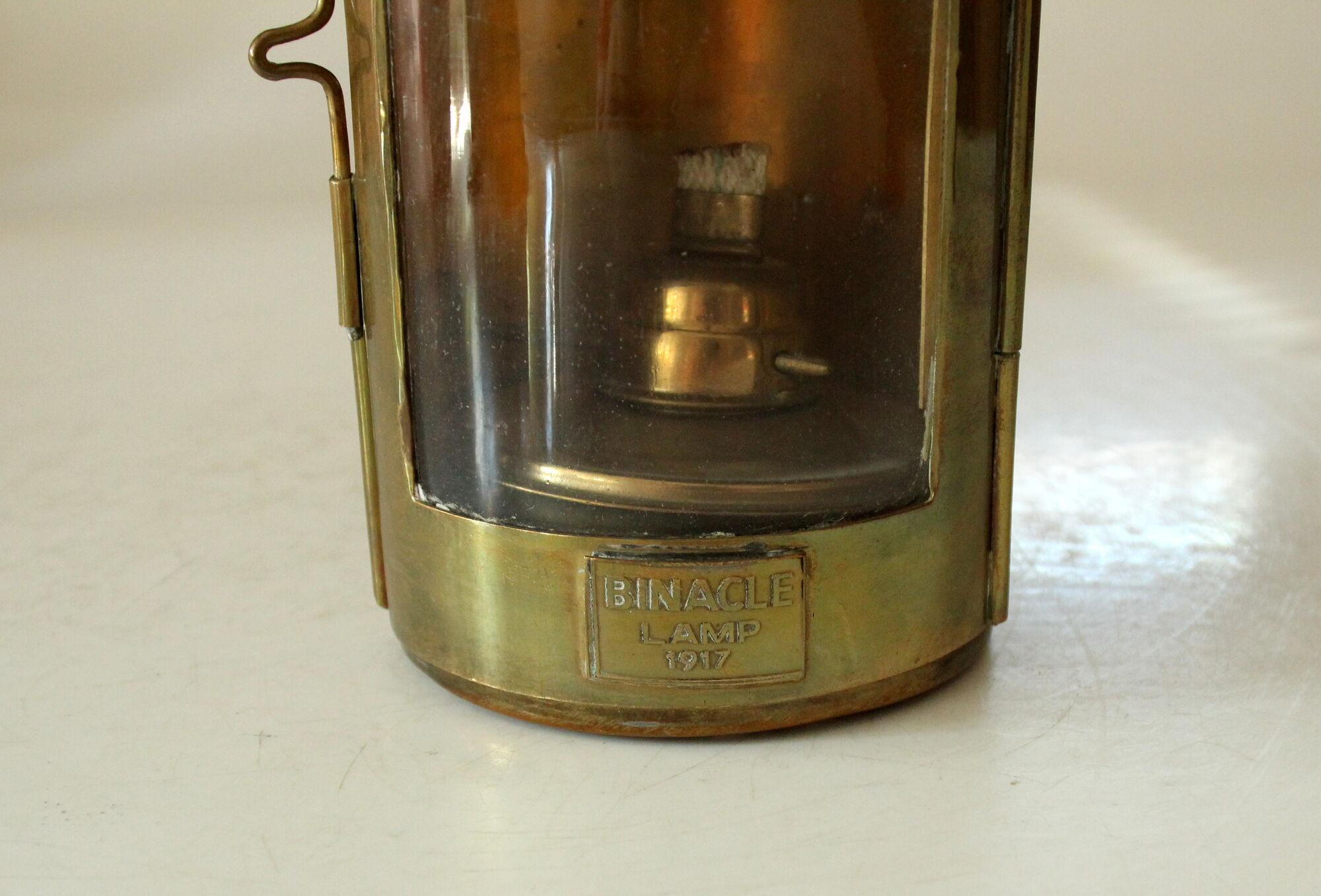 Decorative brass and glass oil lamp, wind light with wooden handle, vintage from the 1970s