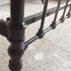 old bed with vintage painted metal bars