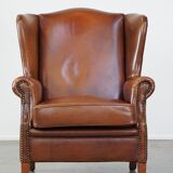Fauteuil à oreilles en cuir de vachette cognac