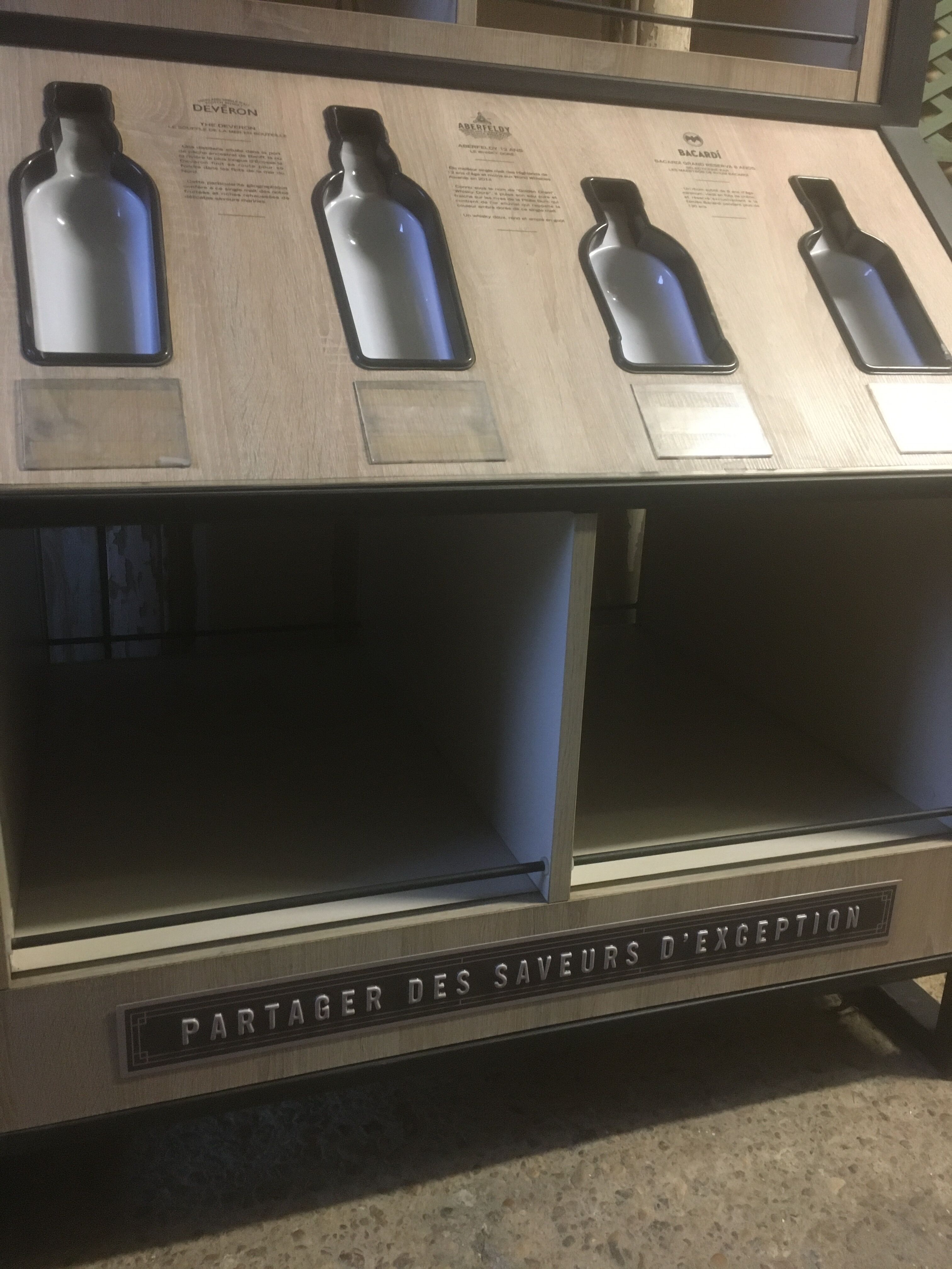 Store display for whisky and rum in metal and melamine