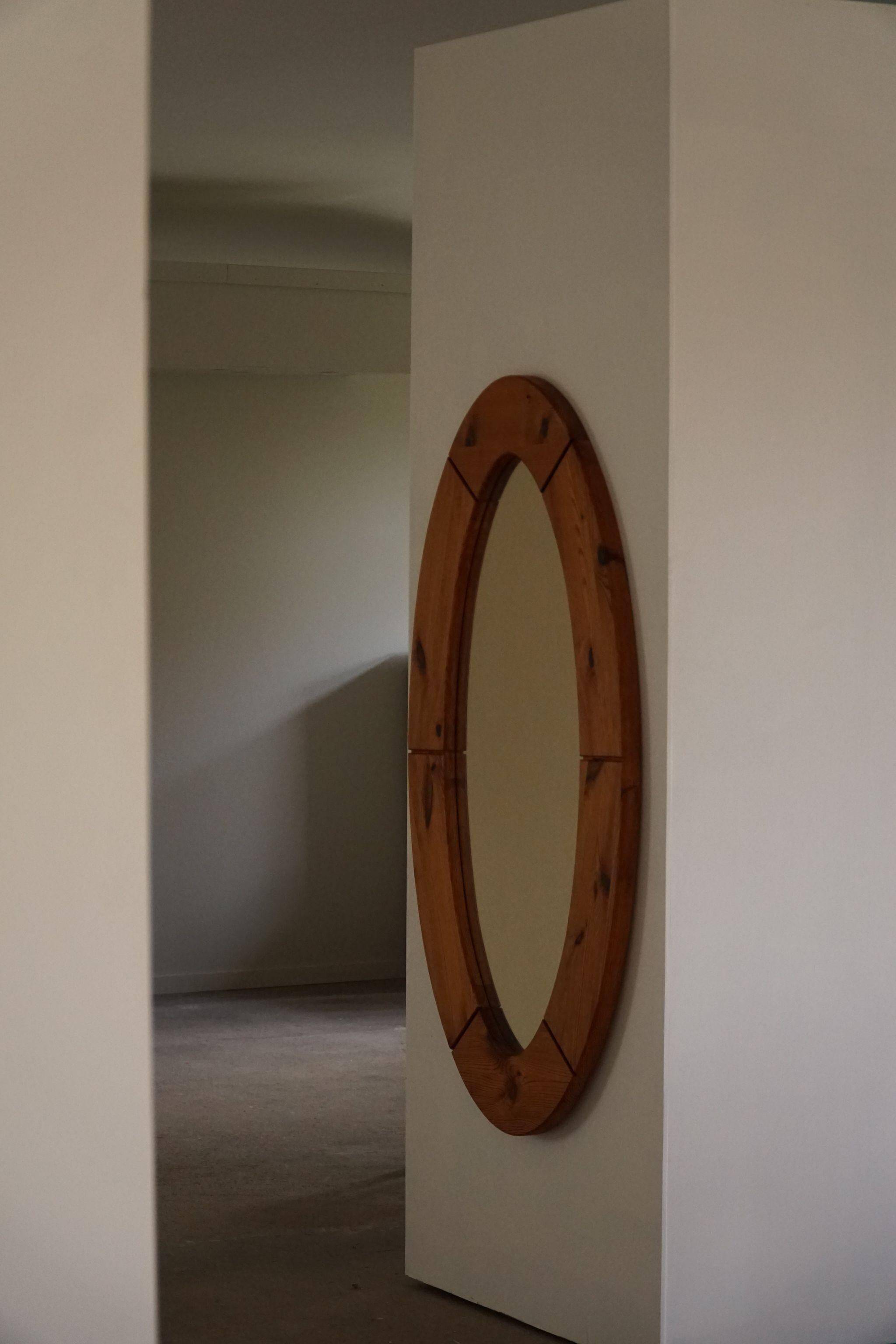 Large oval wall mirror in solid pine by Glasmäster Markaryd, Sweden, 1960s.