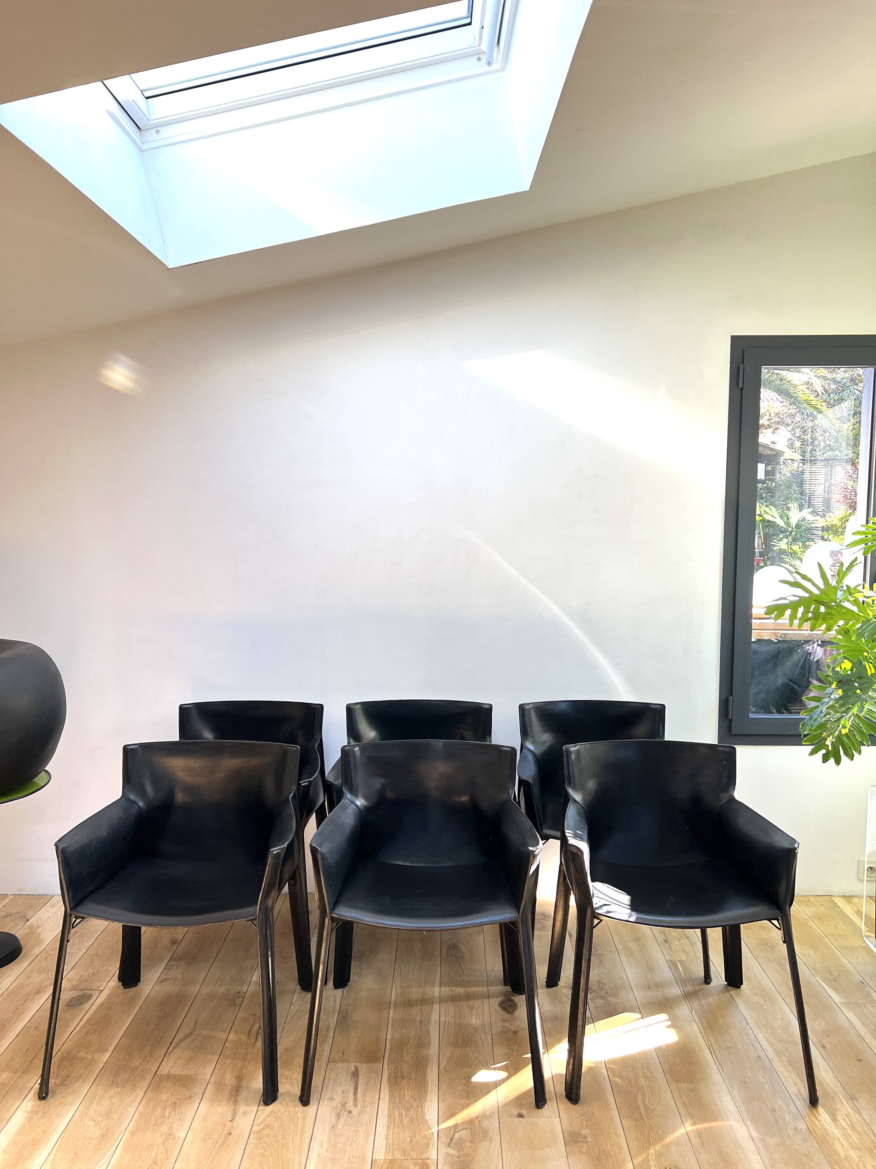 Set of 6 black leather armchairs from the 1970s