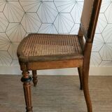Solid oak art deco chair with cane and fabric.