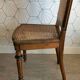 Solid oak art deco chair with cane and fabric.