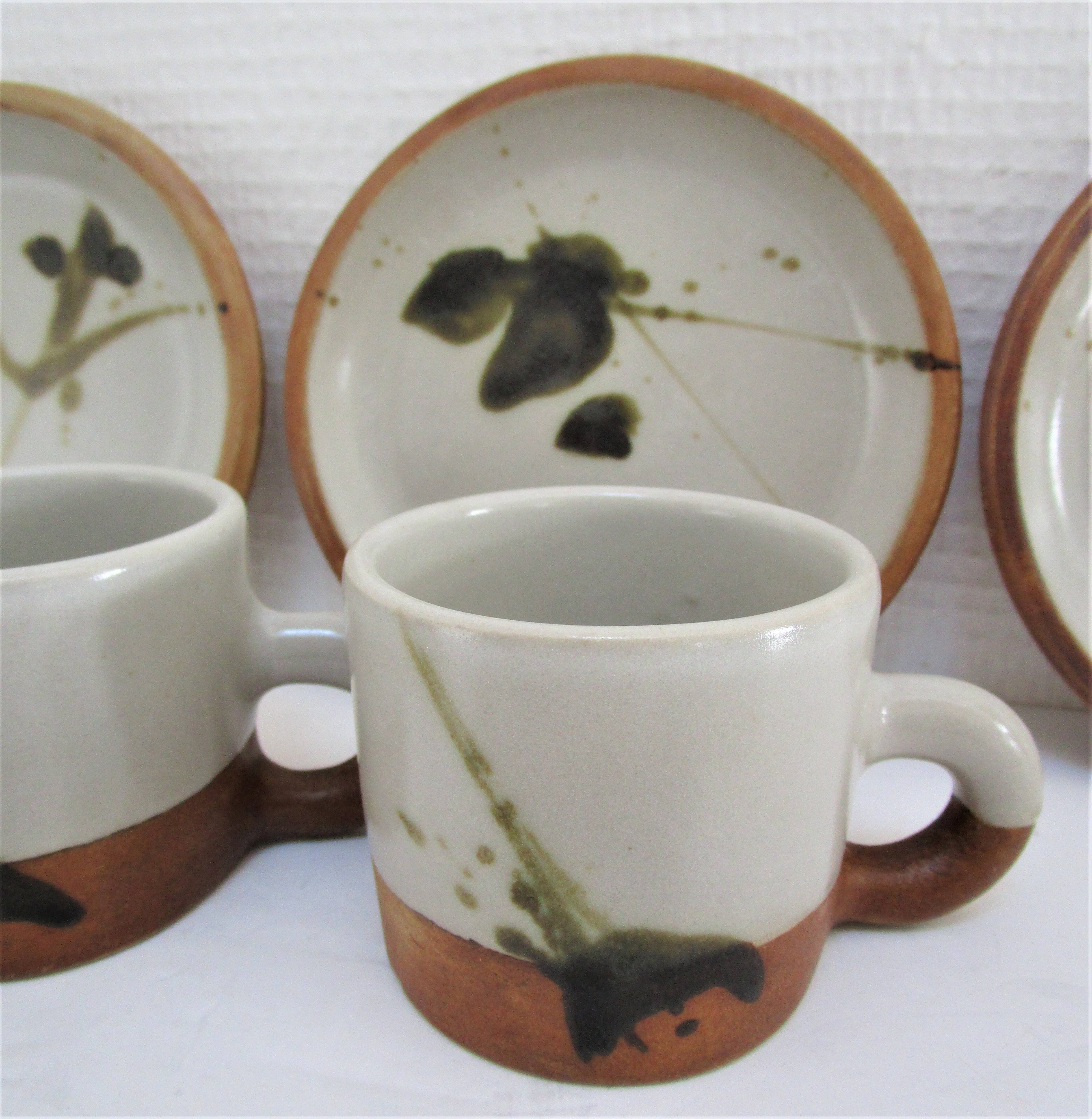 Four pottery cups and saucers from La Colombe Vallauris