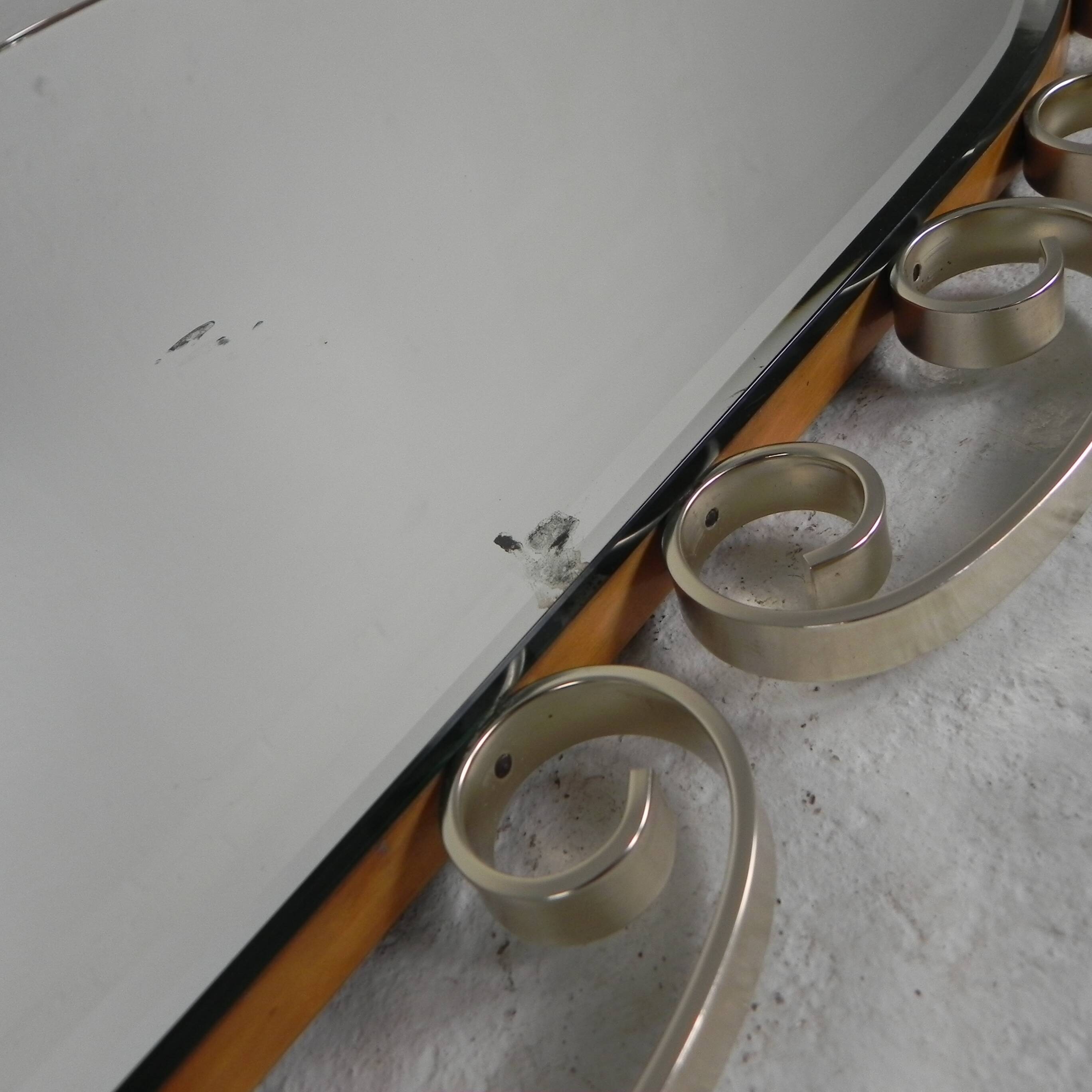 Vintage faceted mirror in an aluminium frame from the 1950s.