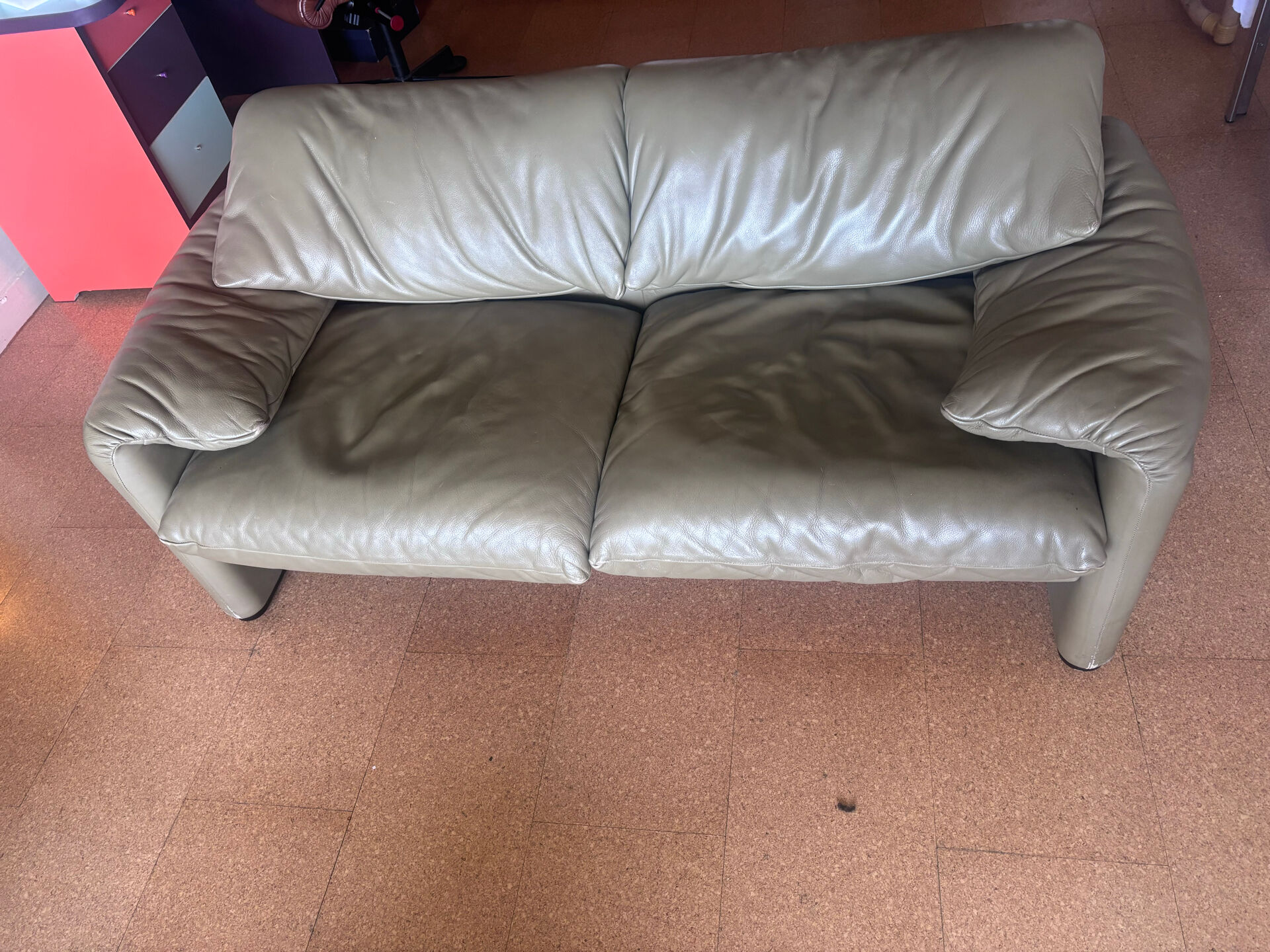 Two-seater Maralunga sofa in olive green leather.