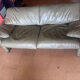 Two-seater Maralunga sofa in olive green leather.
