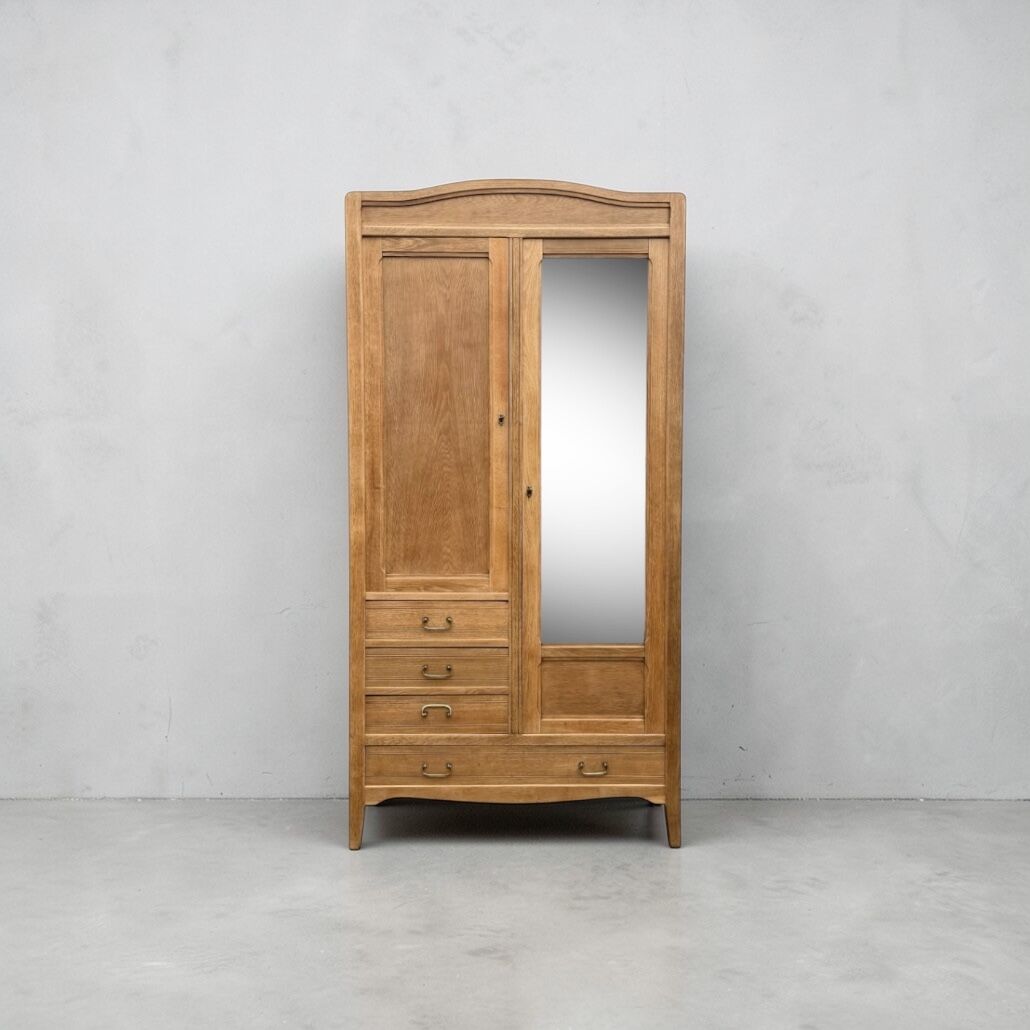 Parisian hotel wardrobe with bevelled mirror, solid raw oak, 1920.