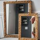 Paire de miroirs anciens en bois et en plâtre doré