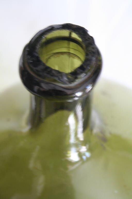 Blown green demijohn