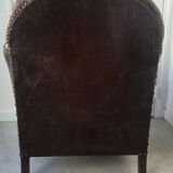 Club armchair in studded leather - early twentieth century