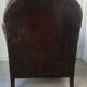 Club armchair in studded leather - early twentieth century