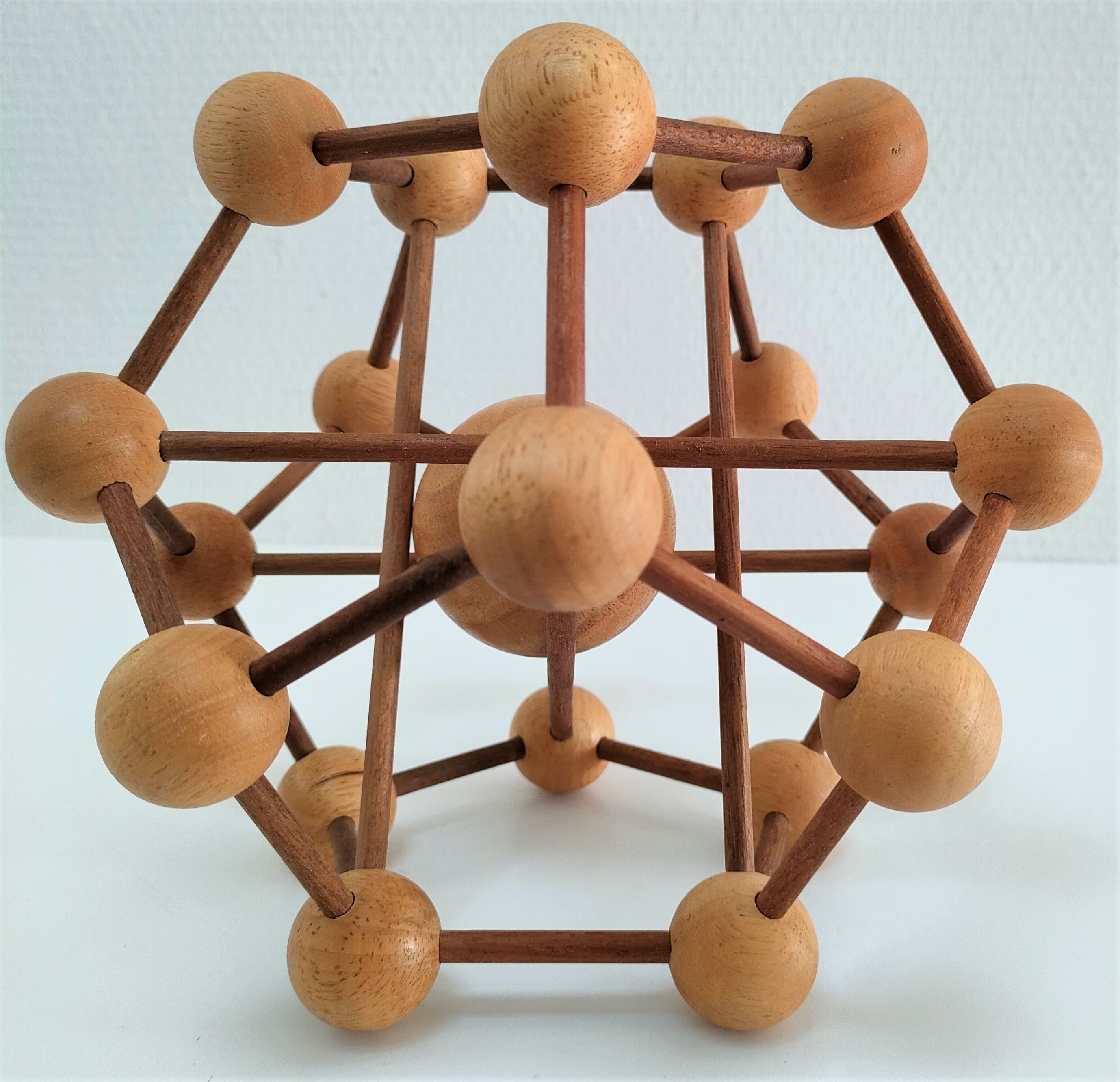Sculptural modeling of a solid wood atom contemporary design
