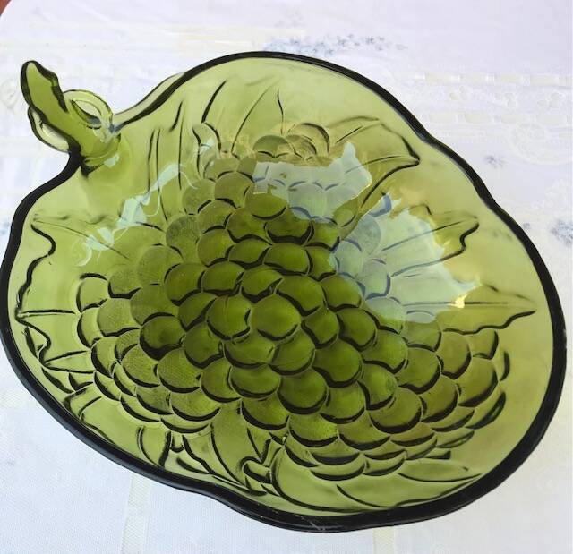 Fruit basket with bunch of grapes