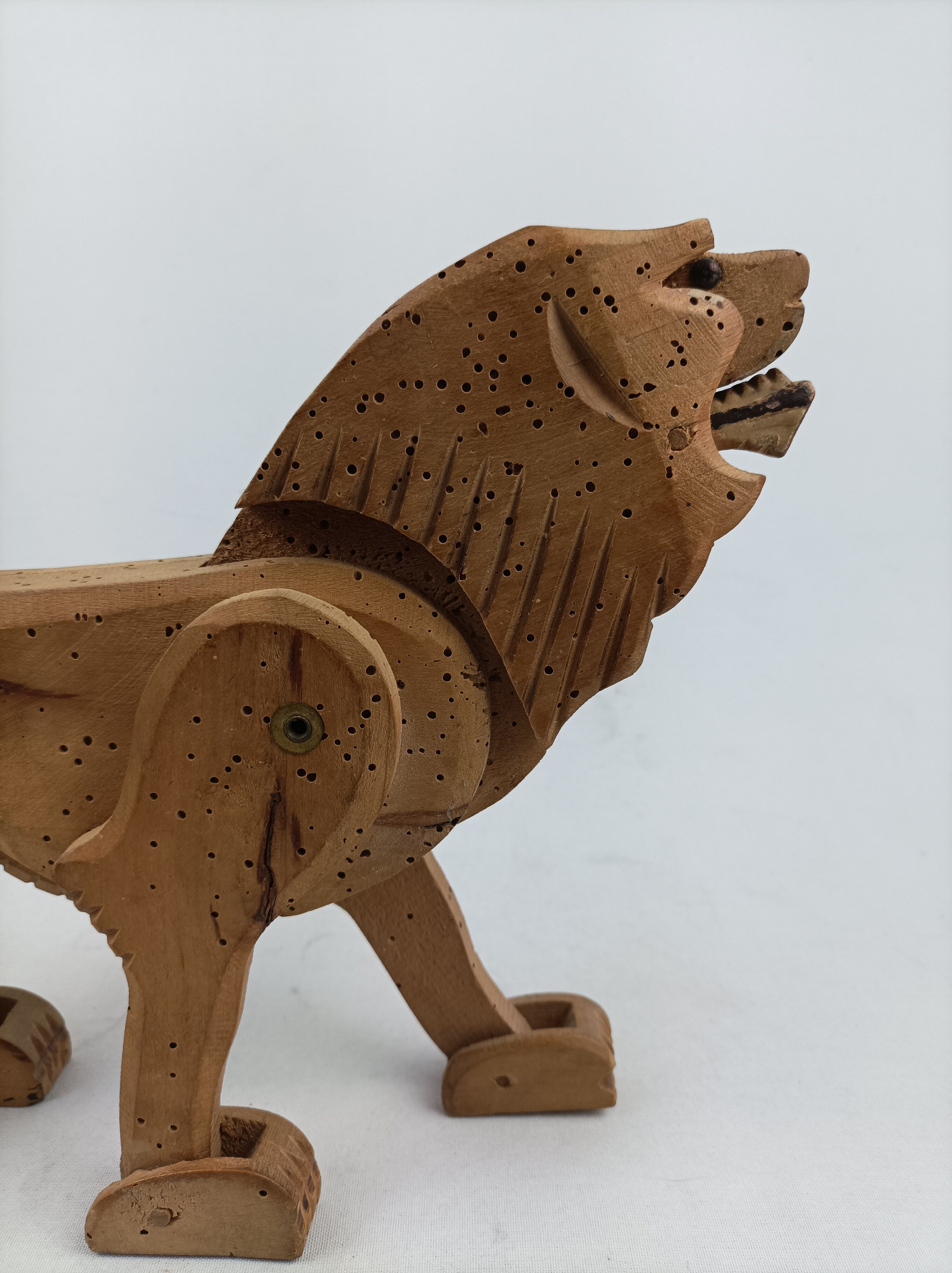 Articulated wooden lion