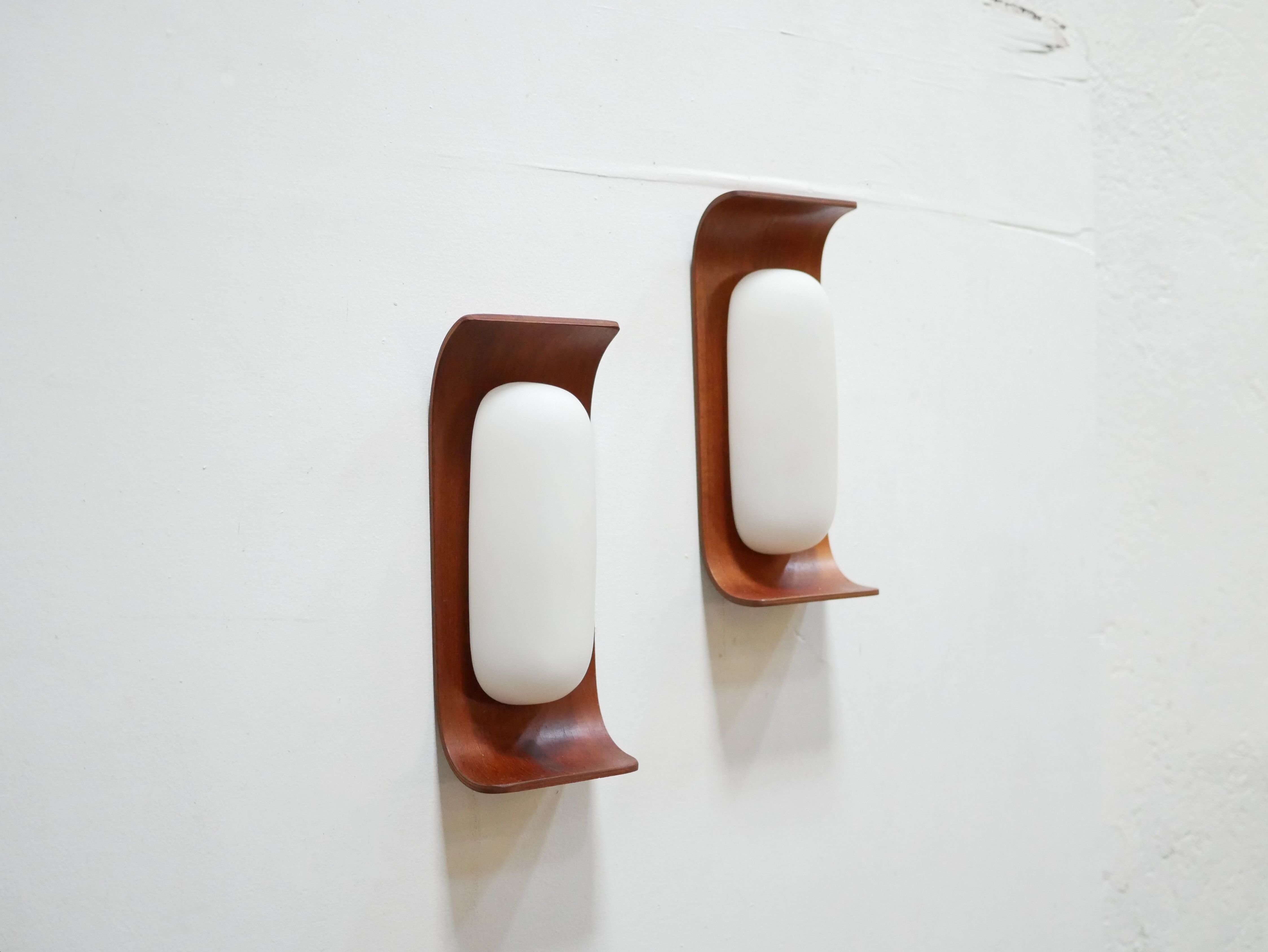 Pair of teak and opaline wall lamps by Goffredo Reggiani