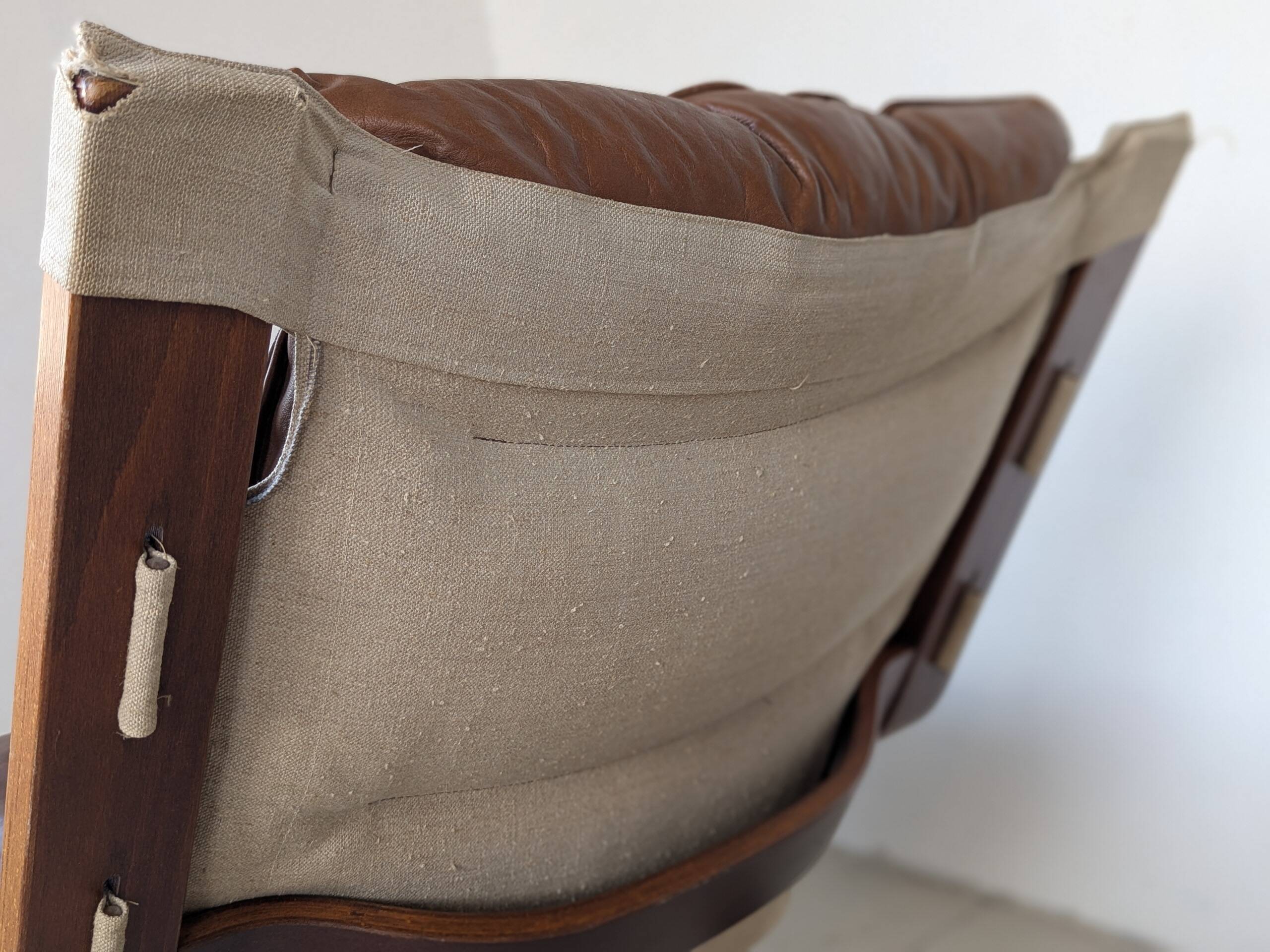 Leather and wood armchair, brutalist style.